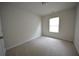 Simple bedroom with neutral walls and carpeted floor at 3284 Pennington Dr, Lithonia, GA 30038