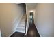 Bright foyer with hardwood floors and staircase to upper level at 3284 Pennington Dr, Lithonia, GA 30038