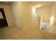 Upstairs hallway with carpeted floor and doors to bedrooms at 3284 Pennington Dr, Lithonia, GA 30038