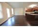 Open concept kitchen with granite countertops and dark wood cabinets at 3284 Pennington Dr, Lithonia, GA 30038