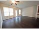 Spacious living room featuring dark hardwood floors and access to backyard at 3284 Pennington Dr, Lithonia, GA 30038