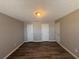 Basement with luxury vinyl plank flooring, neutral walls, and multiple doors at 7645 Broadhurst Dr, Riverdale, GA 30296