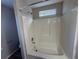 Bathroom with shower/tub combo and window at 7645 Broadhurst Dr, Riverdale, GA 30296