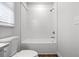 Freshly remodeled bathroom with white tiled walls and a new tub and shower combo at 3215 Concord Cir, Smyrna, GA 30080