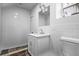 Modern bathroom featuring white subway tile, a vanity with white cabinets, and updated fixtures at 3215 Concord Cir, Smyrna, GA 30080