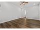 Bedroom featuring wood-look floors, white walls and trim, and a ceiling fan at 3215 Concord Cir, Smyrna, GA 30080
