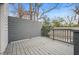 Exterior of home with large wooden deck, gray wood flooring, railing and privacy screen at 3215 Concord Cir, Smyrna, GA 30080
