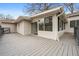 Spacious deck overlooking the backyard with a sliding door to a sunroom and gray wood flooring at 3215 Concord Cir, Smyrna, GA 30080