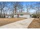 Beautiful house featuring a gray brick exterior, a well-manicured front yard, and a paved driveway at 3215 Concord Cir, Smyrna, GA 30080