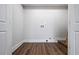 Bright, unfinished laundry room with hookups offers a blank canvas to customize at 3215 Concord Cir, Smyrna, GA 30080