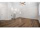 Open living room with ceiling fan, modern floors, and an abundance of natural light at 3215 Concord Cir, Smyrna, GA 30080