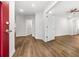 Bright room featuring wood-look floors, white walls and trim, and doors and hallways to other rooms at 3215 Concord Cir, Smyrna, GA 30080