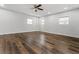 Bright living room features hardwood floors, ceiling fan, natural light from the windows and a backdoor at 3215 Concord Cir, Smyrna, GA 30080