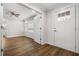 Bright room featuring wood-look floors, white walls and trim, and a front door with glass at 3215 Concord Cir, Smyrna, GA 30080