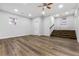 Spacious living room with wood floors, recessed lighting, a ceiling fan, and a walkout door at 3215 Concord Cir, Smyrna, GA 30080