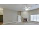 Bright living room with a fireplace and ceiling fan at 3872 Morgans Ridge Dr, Buford, GA 30519