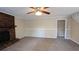 Living room with brick fireplace and neutral carpet at 535 Toonigh Rd, Woodstock, GA 30188