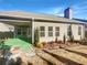 House with covered patio, landscaped backyard, and green grass at 3338 Carolina Wren Sw Trl, Marietta, GA 30060