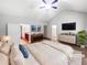 Virtually staged main bedroom with a large bed and walk-in closet at 3338 Carolina Wren Sw Trl, Marietta, GA 30060