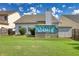 Backyard view showcasing a grassy area and shed at 1305 Leisure Lake Dr, Lawrenceville, GA 30044