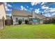 House backyard with grassy area, wooden fence, and shed at 1305 Leisure Lake Dr, Lawrenceville, GA 30044