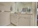 Bathroom with double vanity, mirror, and shower at 1305 Leisure Lake Dr, Lawrenceville, GA 30044