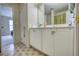Clean bathroom with double vanity and shower/tub combo at 1305 Leisure Lake Dr, Lawrenceville, GA 30044