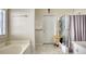 Bathroom with bathtub, shower, and updated fixtures at 1305 Leisure Lake Dr, Lawrenceville, GA 30044