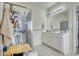 Bathroom with double vanity, shower, and linen storage at 1305 Leisure Lake Dr, Lawrenceville, GA 30044
