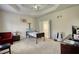 Bedroom with hospital bed, office space, and plenty of natural light at 1305 Leisure Lake Dr, Lawrenceville, GA 30044