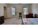 Relaxing bedroom with large bed, chair, and access to backyard at 1305 Leisure Lake Dr, Lawrenceville, GA 30044