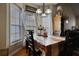 Bright dining room featuring bay window and seating for four at 1305 Leisure Lake Dr, Lawrenceville, GA 30044