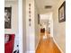 Bright hallway with hardwood floors, leading to living areas at 1305 Leisure Lake Dr, Lawrenceville, GA 30044