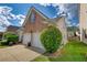 House exterior showcasing a side view of the home and landscaping at 1305 Leisure Lake Dr, Lawrenceville, GA 30044
