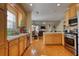 Open concept kitchen with island and stainless steel appliances at 1305 Leisure Lake Dr, Lawrenceville, GA 30044