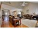 Open living room and kitchen with hardwood floors and vaulted ceilings at 1305 Leisure Lake Dr, Lawrenceville, GA 30044