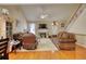 Living room with hardwood floors, fireplace and ample seating at 1305 Leisure Lake Dr, Lawrenceville, GA 30044