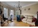 Elegant living room with hardwood floors and bay window at 1305 Leisure Lake Dr, Lawrenceville, GA 30044
