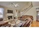 Living room featuring hardwood floors, fireplace, and high ceilings at 1305 Leisure Lake Dr, Lawrenceville, GA 30044