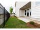 Private backyard with patio and black metal fence at 148 Birch Tree Way, Cumming, GA 30040