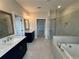 Modern bathroom boasting double vanities and a walk-in shower at 148 Birch Tree Way, Cumming, GA 30040