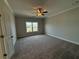 Spacious bedroom with window and carpet flooring at 148 Birch Tree Way, Cumming, GA 30040