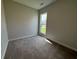Bright bedroom with neutral walls and carpet flooring at 148 Birch Tree Way, Cumming, GA 30040