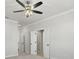 Spacious bedroom with ceiling fan and carpet flooring at 148 Birch Tree Way, Cumming, GA 30040