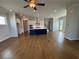 Spacious living area with hardwood floors and kitchen view at 148 Birch Tree Way, Cumming, GA 30040