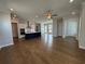 Open floor plan living room with hardwood floors and kitchen at 148 Birch Tree Way, Cumming, GA 30040