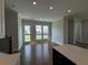 Bright living room with hardwood floors and access to backyard at 148 Birch Tree Way, Cumming, GA 30040