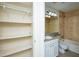 Bathroom with linen closet and beige tile at 6800 Glenridge Dr # 6810H, Sandy Springs, GA 30328