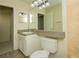 Bathroom features a granite countertop and beige tile at 6800 Glenridge Dr # 6810H, Sandy Springs, GA 30328