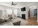 Cozy living room with a fireplace, ceiling fan, and ample seating for Gathering and friends at 981 Rittenhouse Way, Atlanta, GA 30316